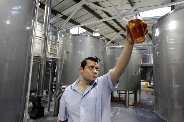 Beer baron: Ben Ott inspects his product 