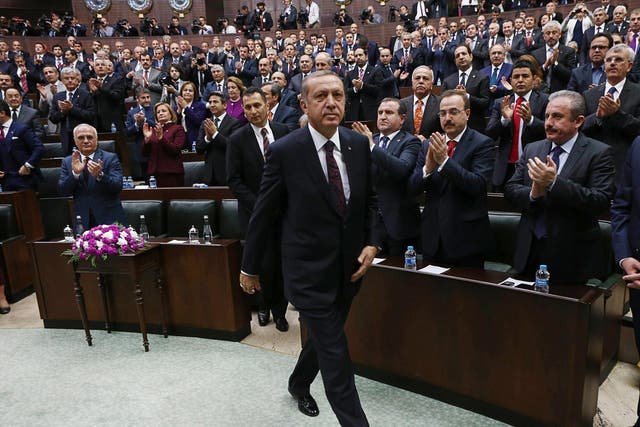 Recep Tayyip Erdogan (centre) greeted by MPs from his Justice and Development (AKP) Party; his government shut down social media over a corruption scandal before recent elections