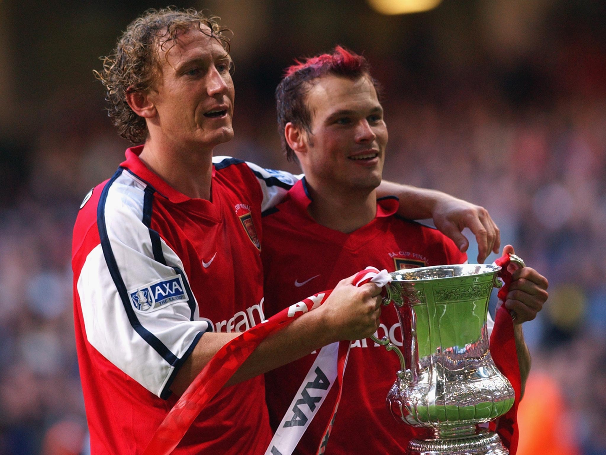 Ray Parlour celebrates the 2002 FA Cup final success for Arsenal with Freddie Ljungberg