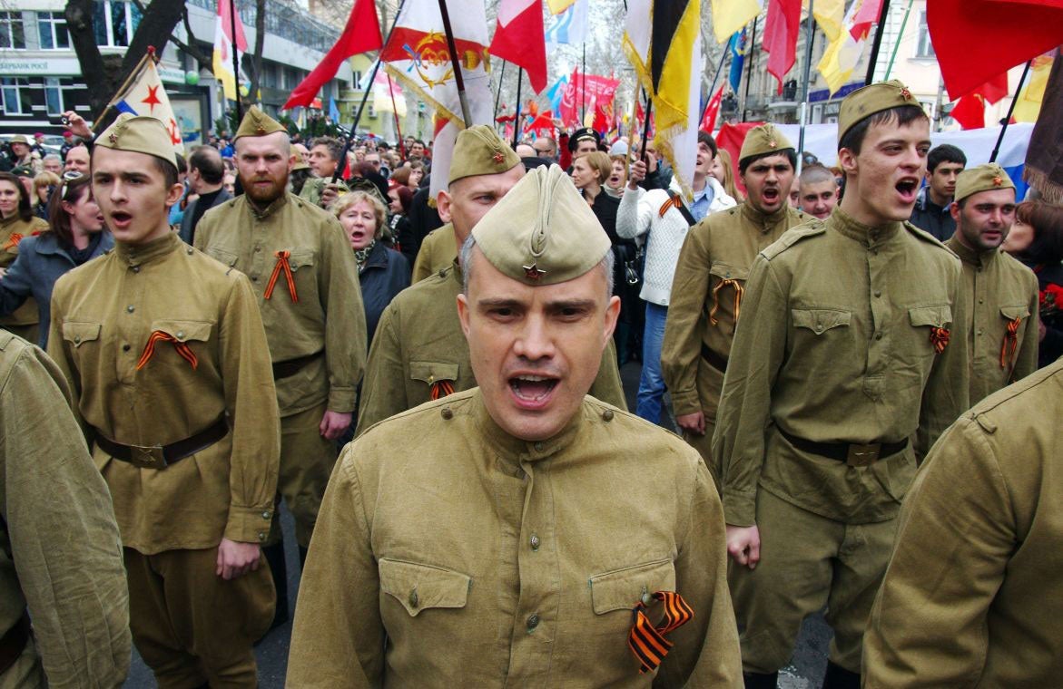Pro-Russian demonstrators dressed in Soviet military uniforms shout slogans as they take part in a rally in the southern Ukrainian city of Odessa