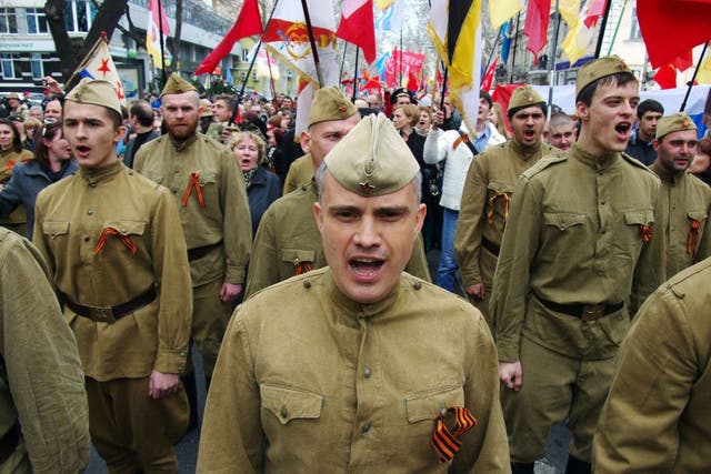 Pro-Russian demonstrators dressed in Soviet military uniforms shout slogans as they take part in a rally in the southern Ukrainian city of Odessa