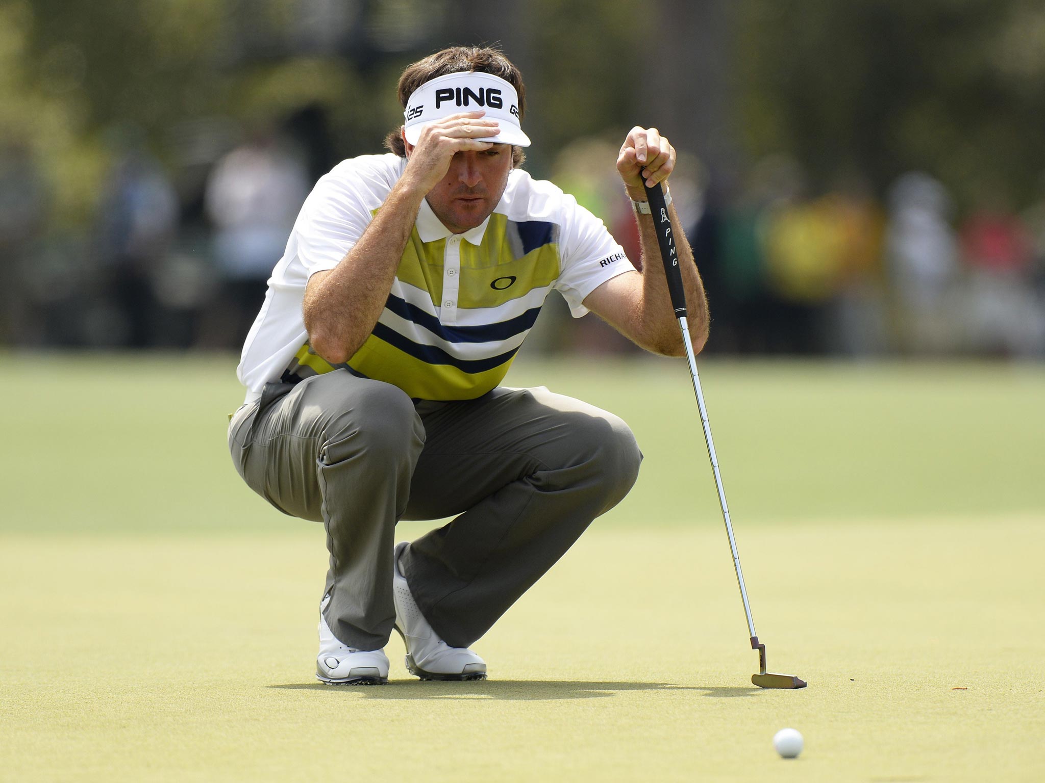 Bubba Watson of the US lines up a putt shot on eighth green during the second round of the 78th Masters Golf Tournament