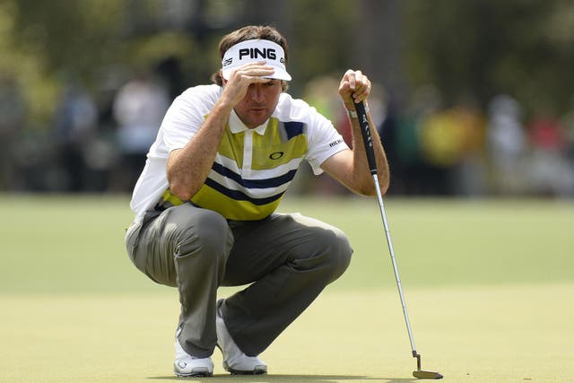 Bubba Watson of the US lines up a putt shot on eighth green during the second round of the 78th Masters Golf Tournament 