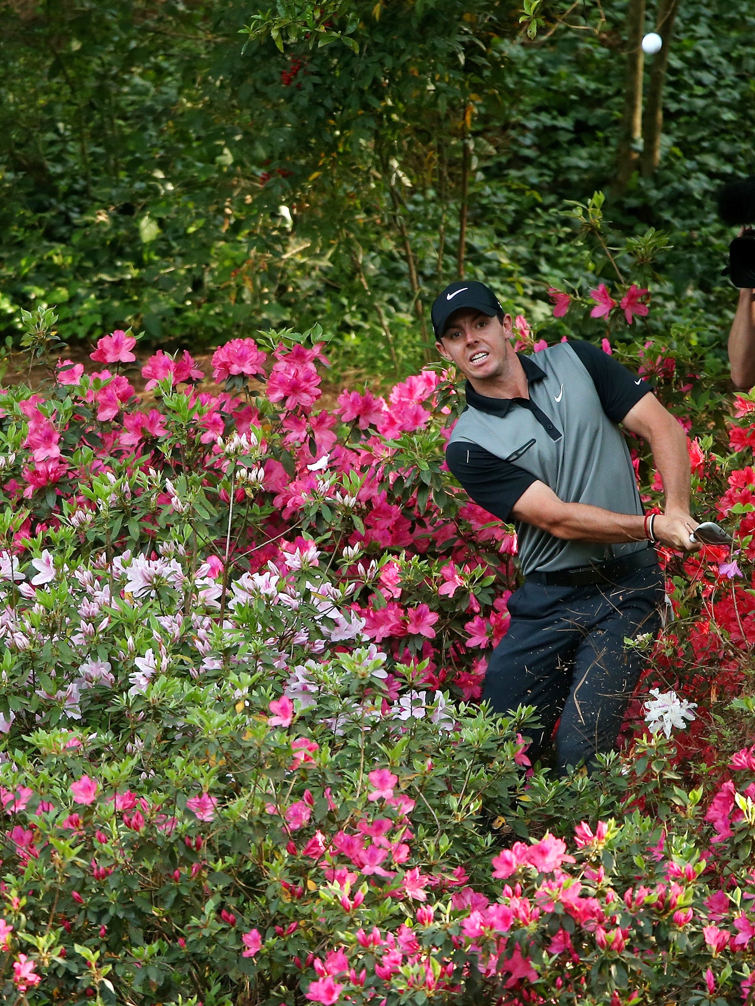 McIlroy visited some seldom-seen parts of the course on the 10th and 13th, the latter after his ball hit a sprinkler and bounded into the azaleas which give the hole its name.