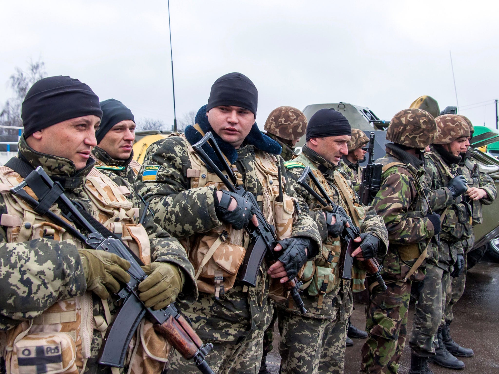 A unit of Ukrainian border guards line up before starting their patrol on the Russian border, in the village of Veseloye, in the Kharkiv region, on 4 April.