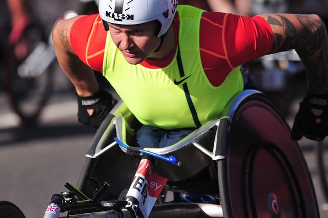 British paralympic wheelchair athlete David Weir takes part in the 2014 London Marathon near Blackheath