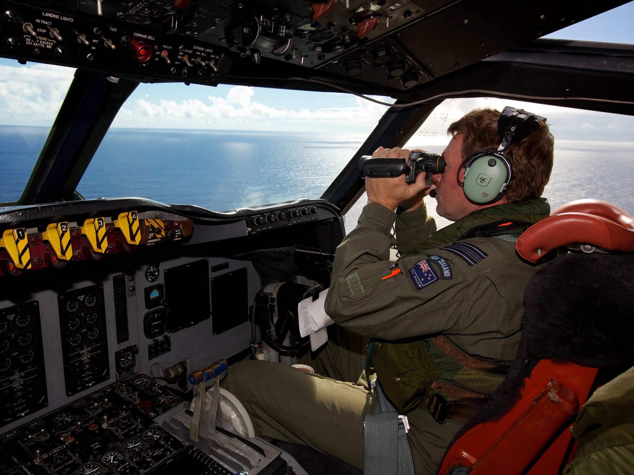 Royal New Zealand Air Force personnel  take part in the search to locate the missing Malaysia Airways Flight MH370 over the Indian Ocean