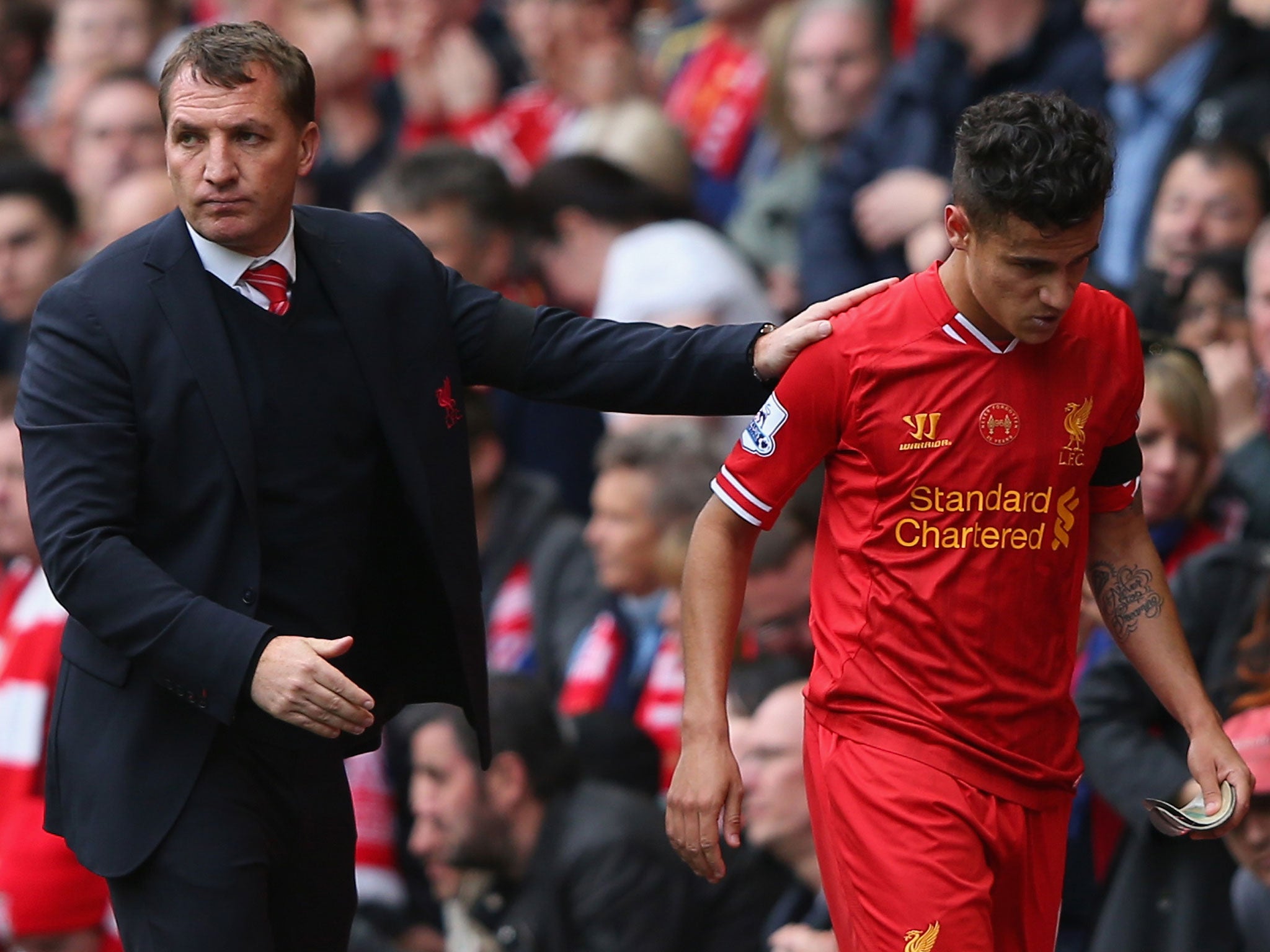 Liverpool Manager Brendan Rodgers (right) congratulates Philippe Coutinho as he is substituted