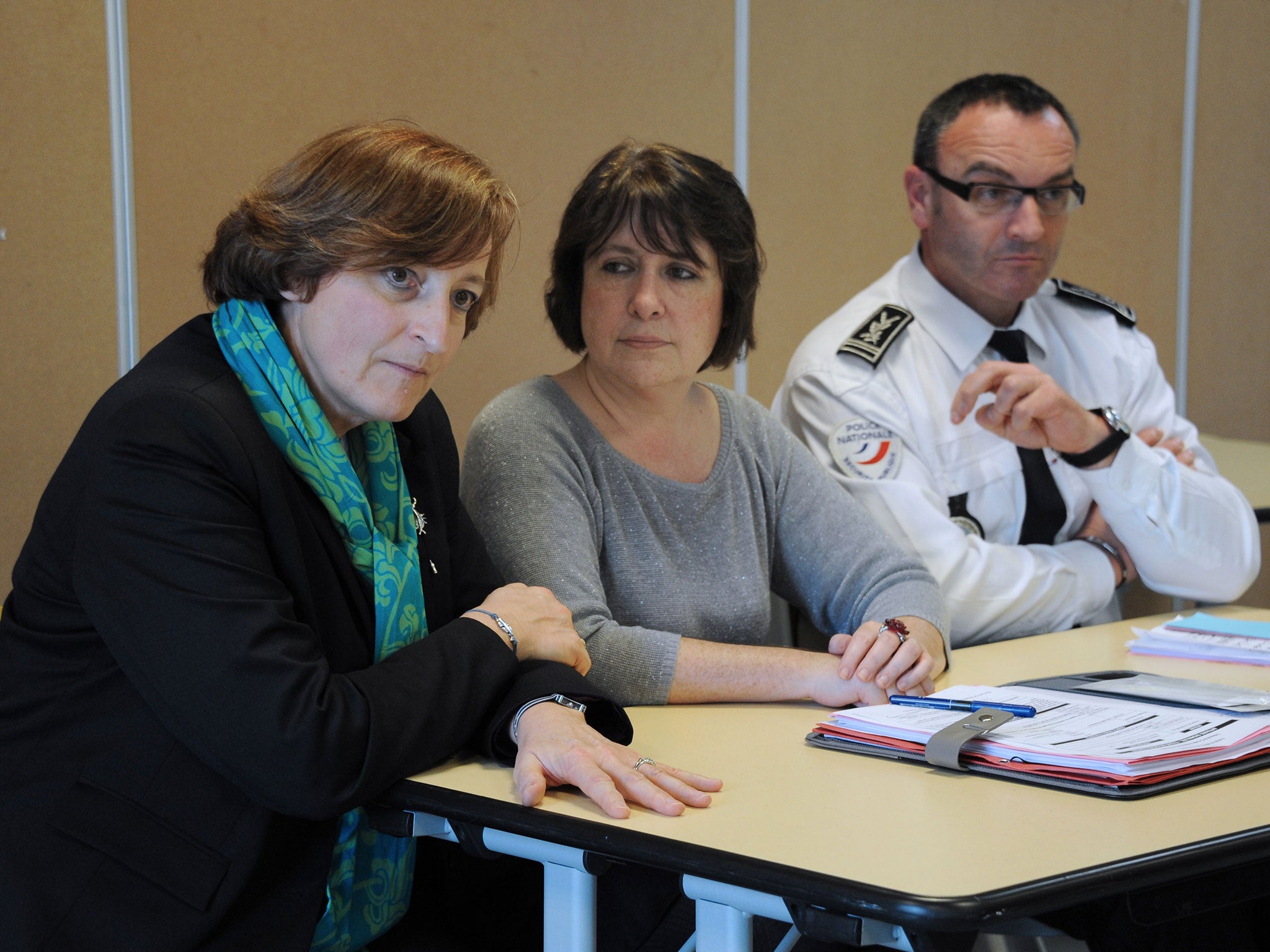 Headteacher Chantal Devaux (L), prosecutor Isabelle Pagenelle (C) and departmental director of public safety Olivier Le Guestre (R) organise a meeting with parents and the press