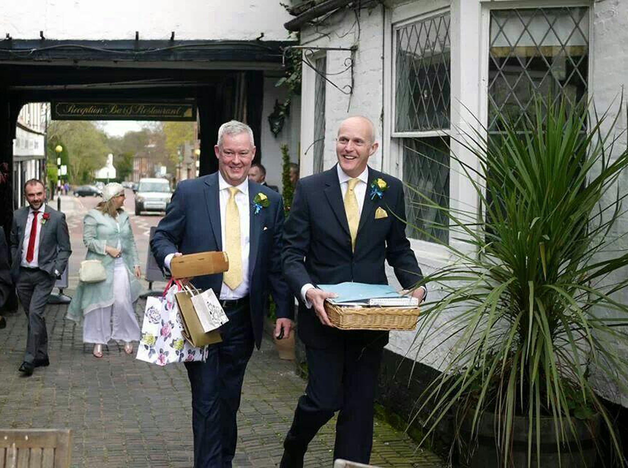 Canon Jeremy Pemberton, 58, and his husband Laurence Cunnington, 51, leave for their honeymoon following the wedding