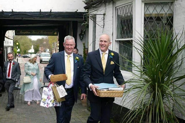 Canon Jeremy Pemberton, 58, and his husband Laurence Cunnington, 51, leave for their honeymoon following the wedding