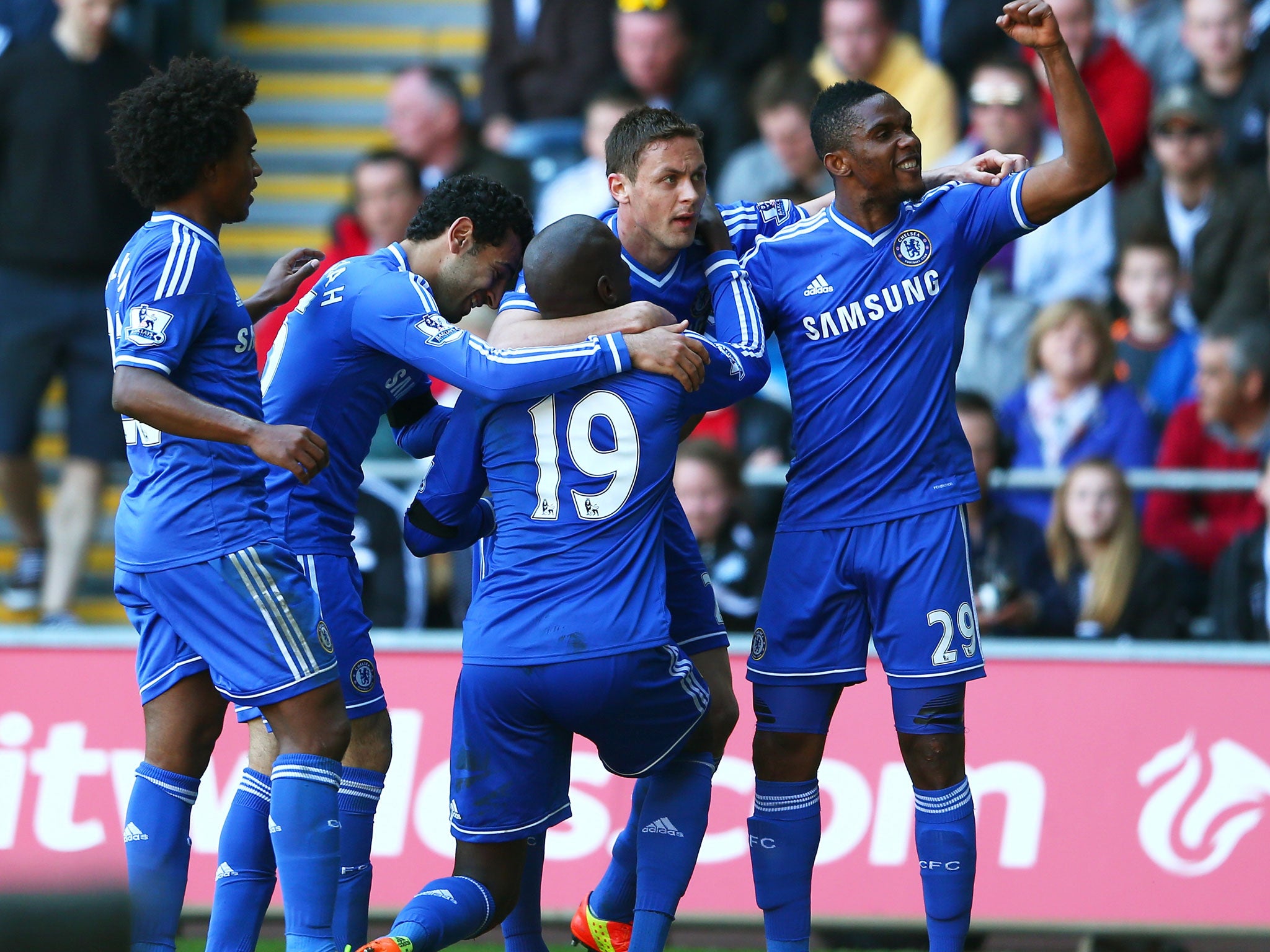 Demba Ba (centre) celebrates his winning goal with Chelsea team-mates