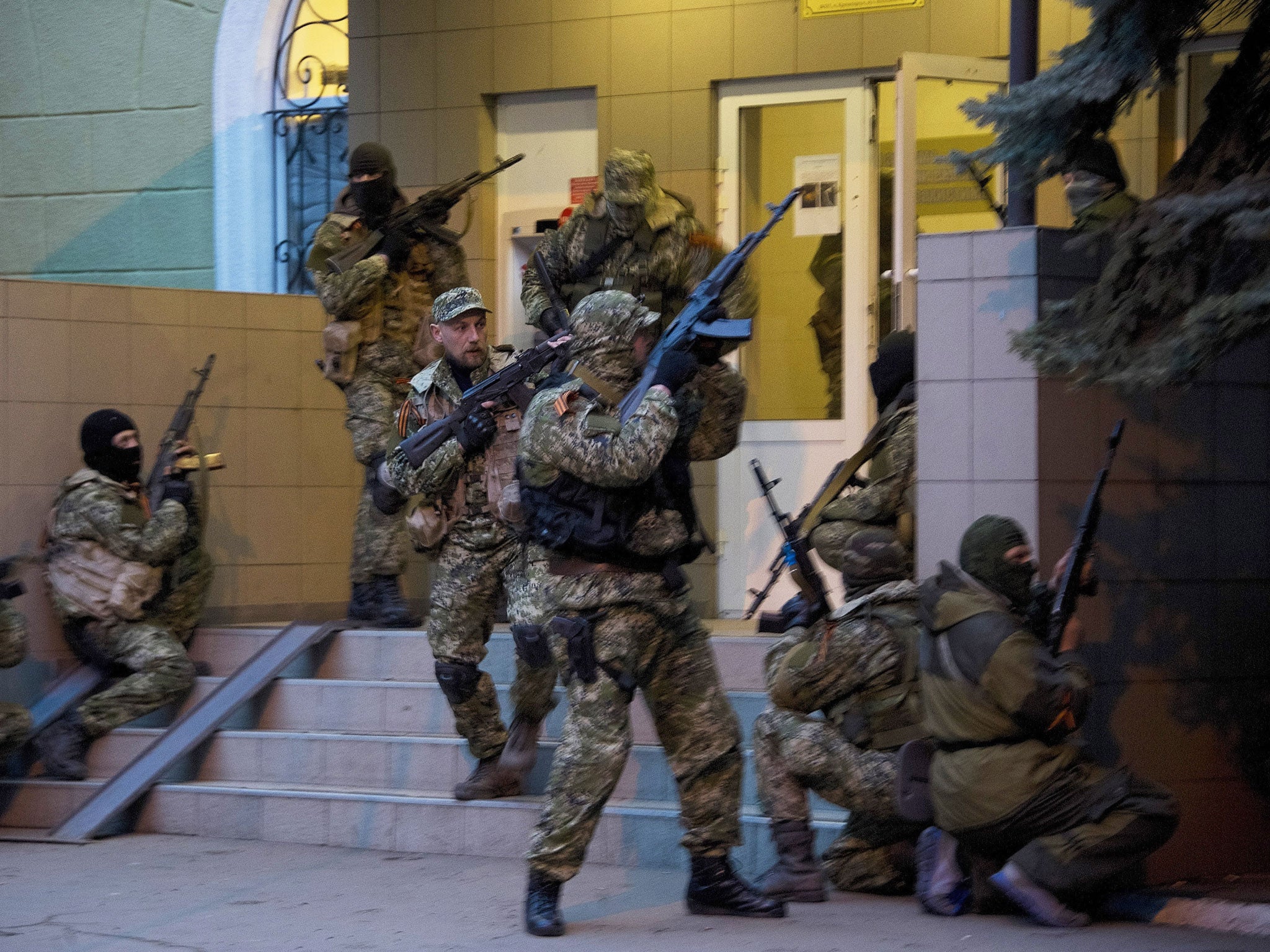 Pro-Russian separatists seizing a police building at the weekend in Slovyansk, eastern Ukraine. Troops in uniform without insignia have appeared as in Crimea