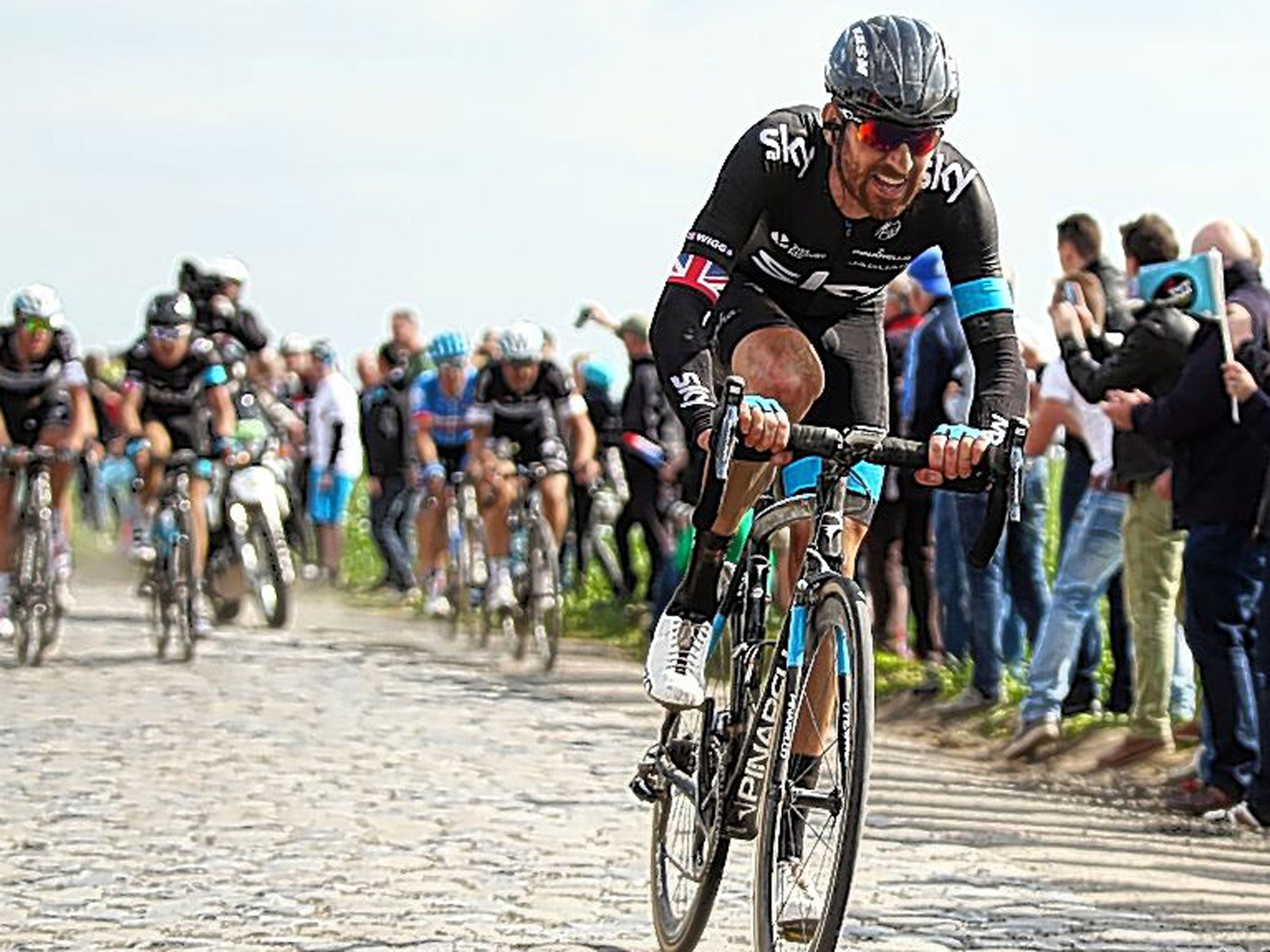 Sir Bradley Wiggins on one of the difficult cobbled sections of the Paris-Roubaix race