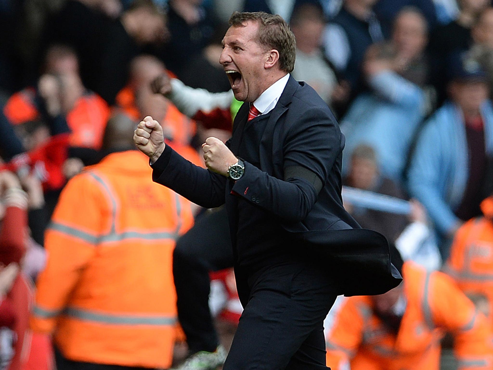 Brendan Rodgers celebrates the 3-2 victory over Manchester City that keeps his Liverpool side top of the Premier League