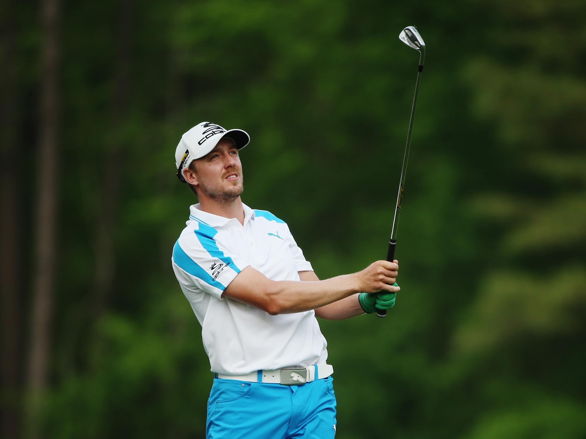 Jonas Blixt of Sweden watches his tee shot on the 12th hole during the final round