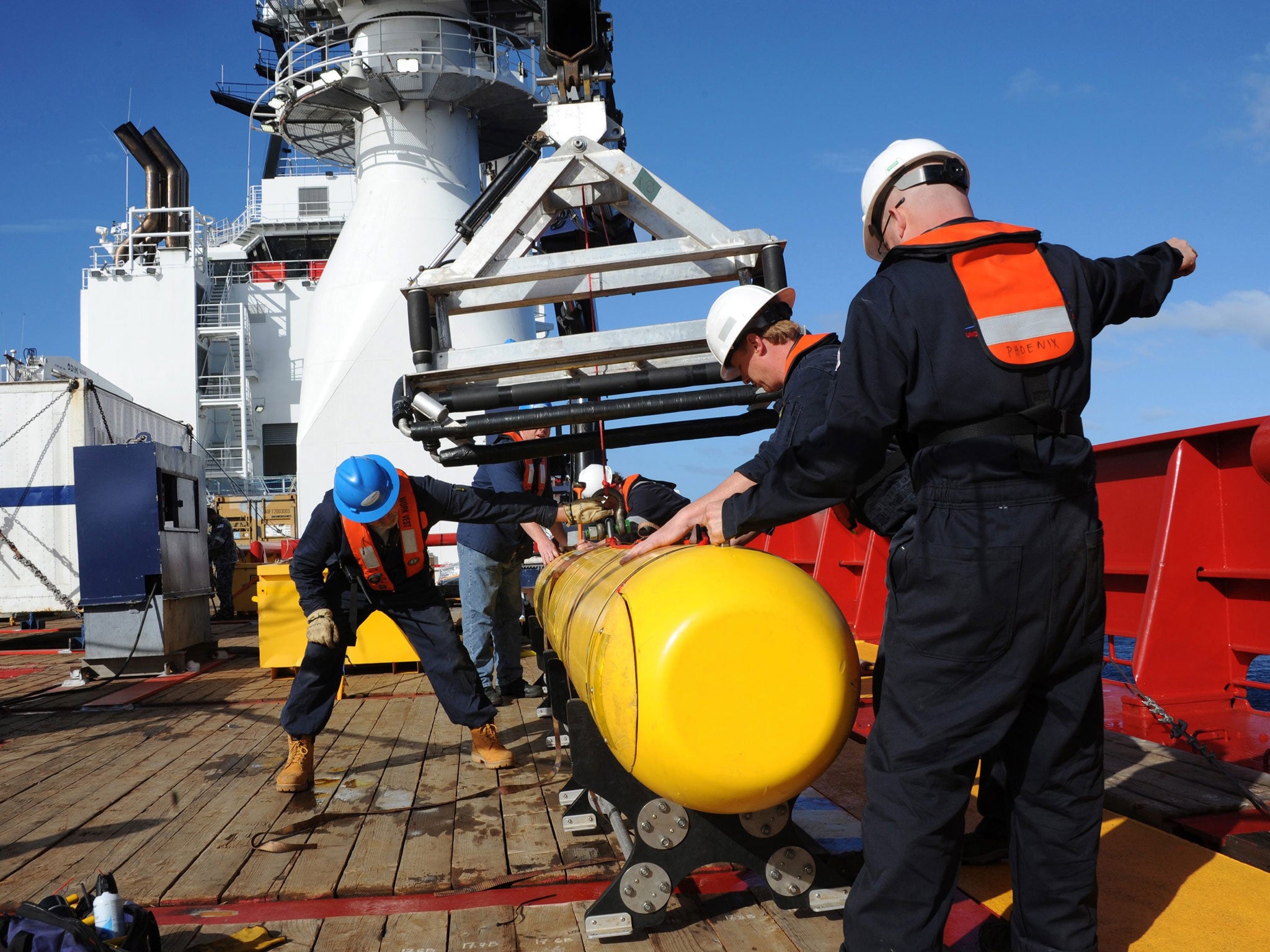 A handout picture made available by the US Navy on 4 April, 2014 shows an autonomous underwater vehicle (AUV) hoisted on board the Australian Ocean Shield after a successful buoyancy testing