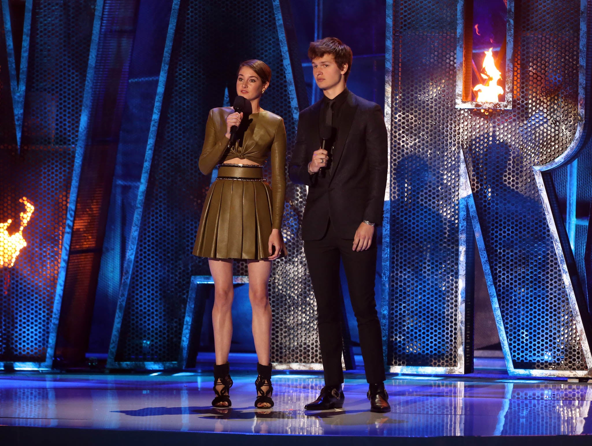 Actors Shailene Woodley (L) and Ansel Elgort speak onstage at the 2014 MTV Movie Awards