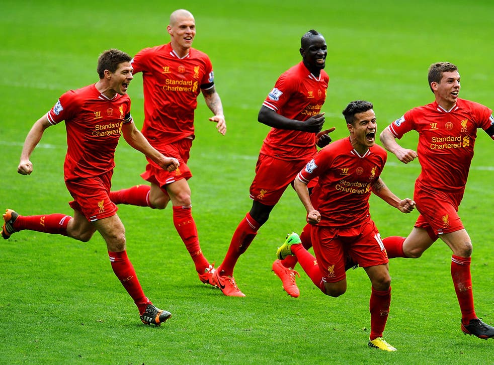 Liverpool players celebrate Philippe Coutinho's winning goal in the 3-2 victory over Manchester City