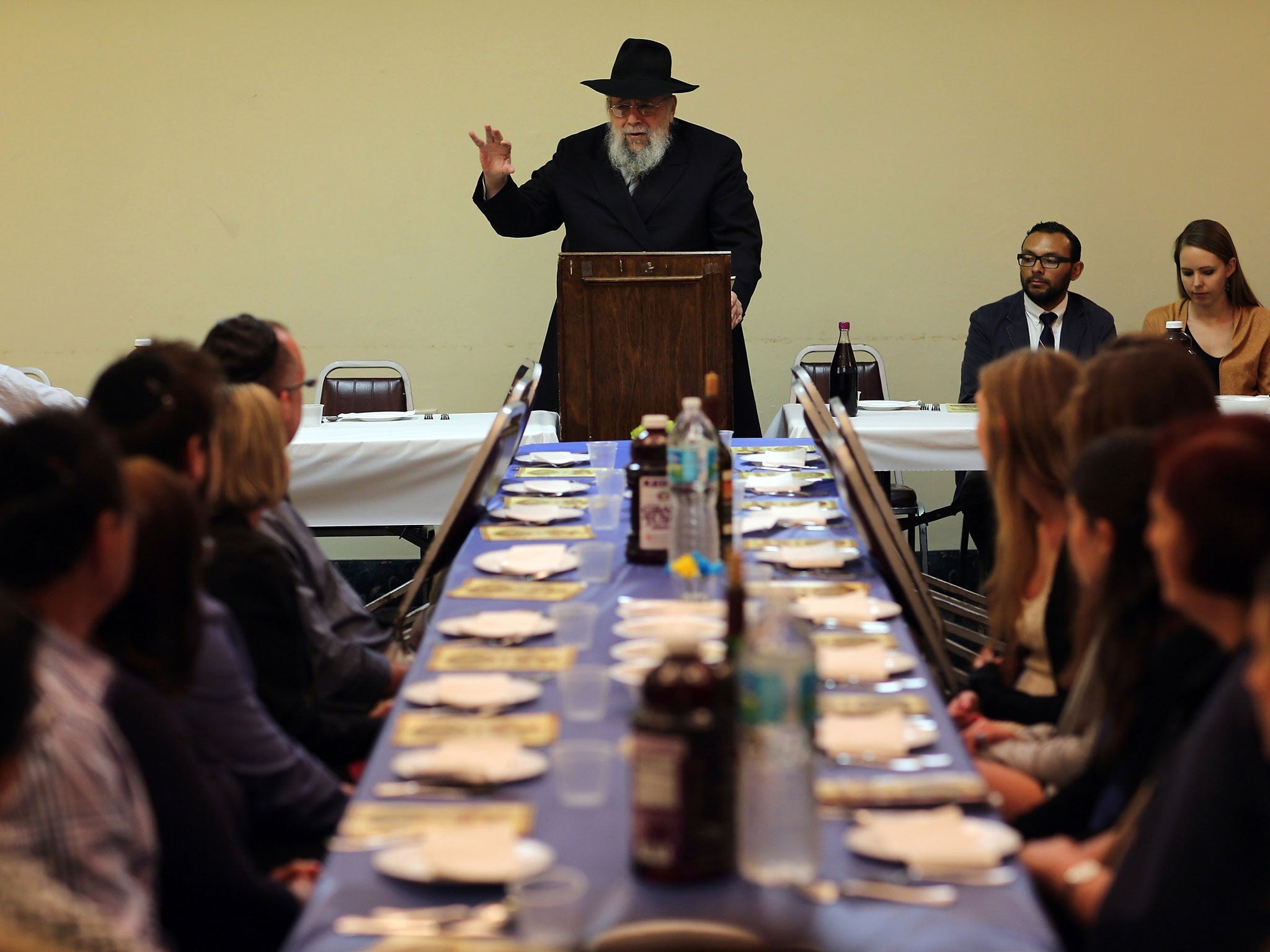 A rabbi leads a community Passover Seder in Miami Beach, Florida