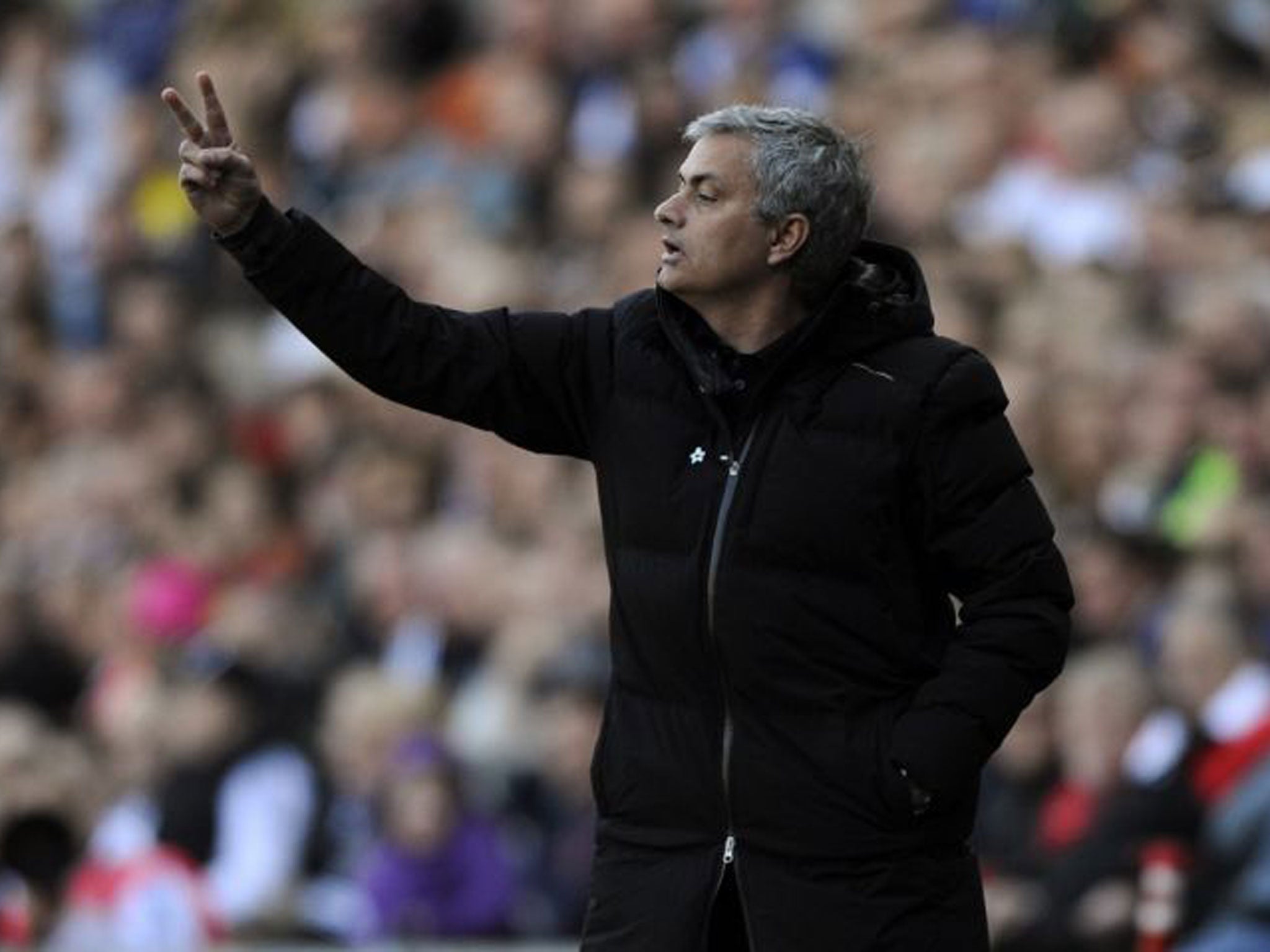 Chelsea manager Jose Mourinho makes a gesture from the touchline