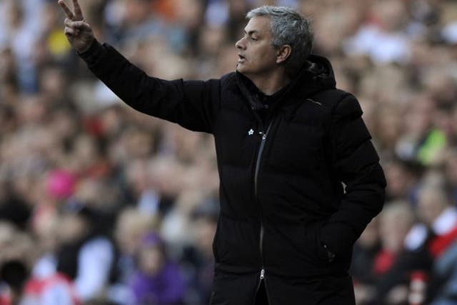 Chelsea manager Jose Mourinho makes a gesture from the touchline