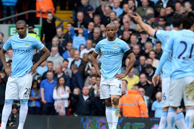 Vincent Kompany looks on after Liverpool score the winning goal in the 3-2 Premier League fixture