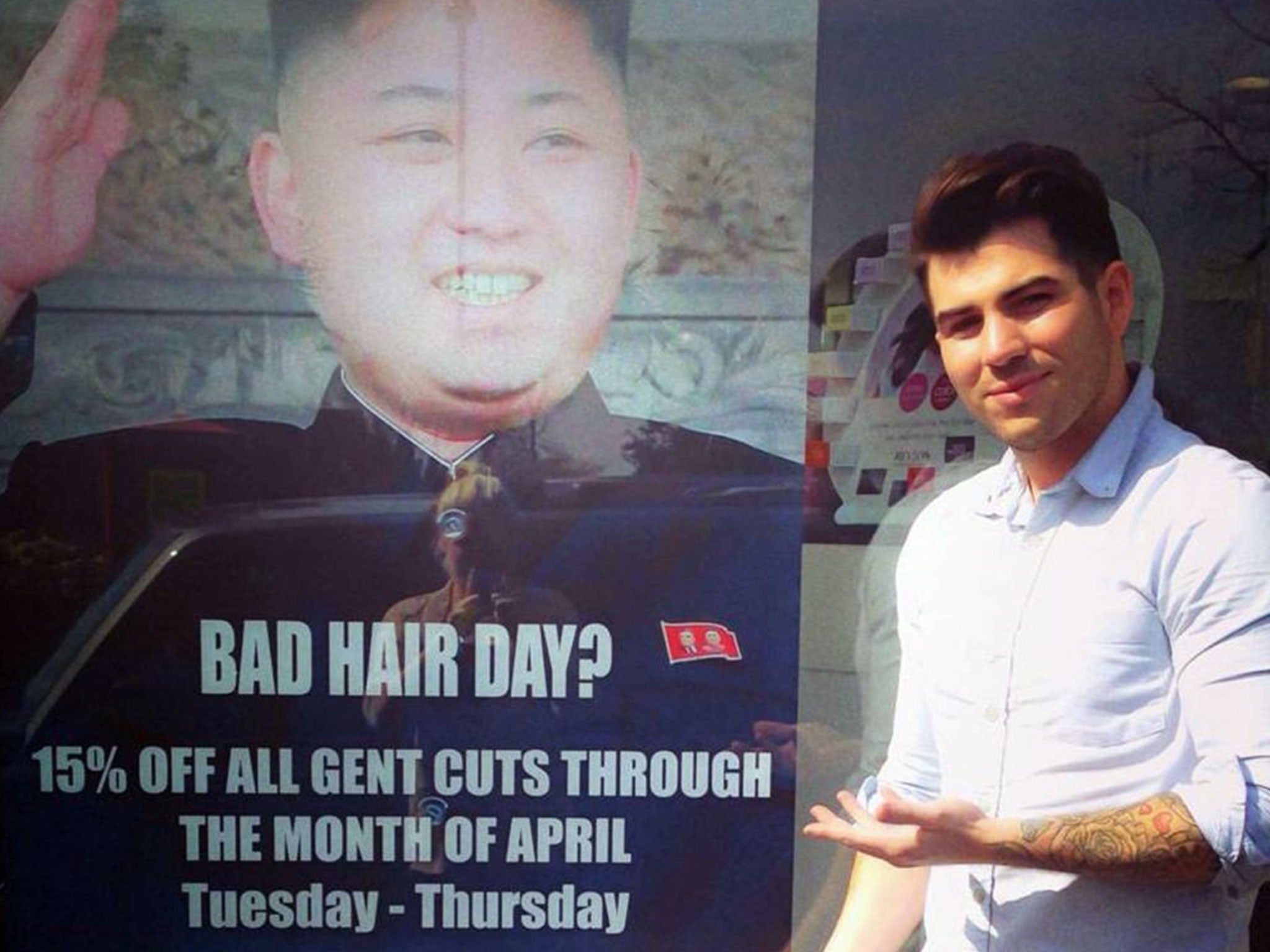 Karim Nabbach with the photo of Kim Jong-un in the window of M&M salon in south Ealing
