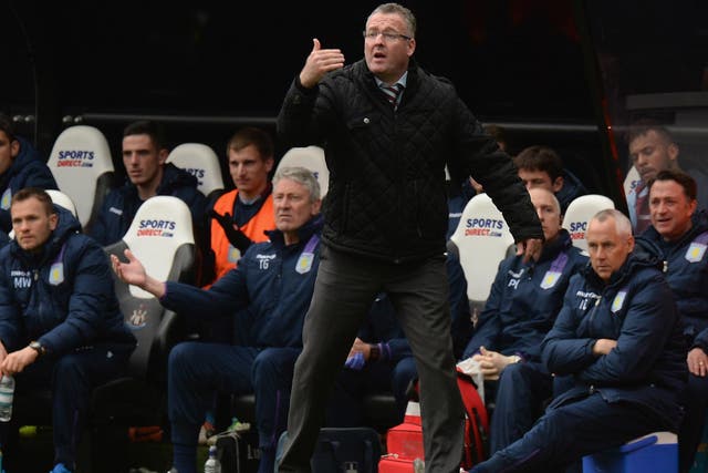 Aston Villa manager Paul Lambert remonstrates on the sideline in front of his coaching staff