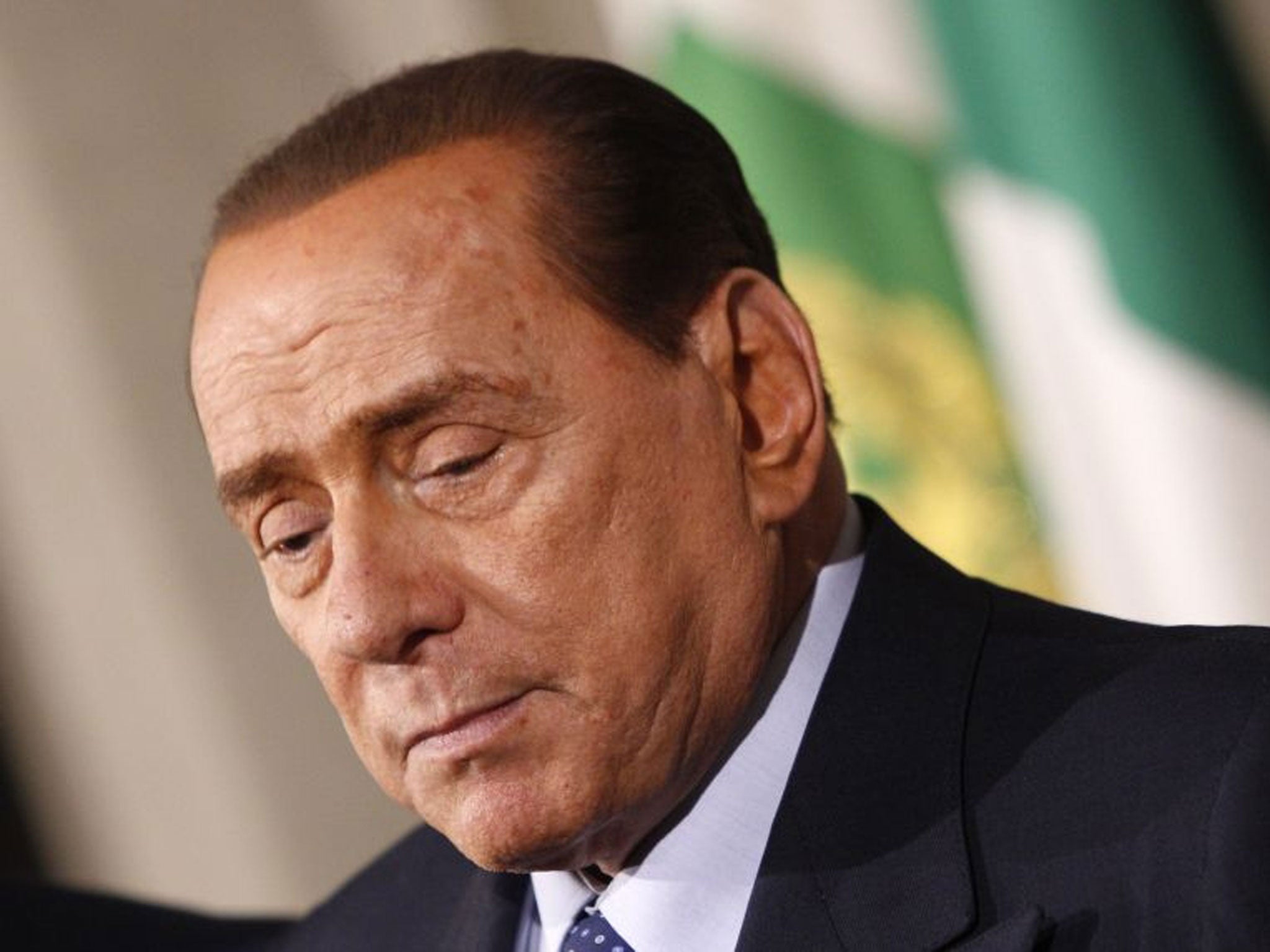 Silvio Berlusconi talks to journalists after a meeting with Italian President Giorgio Napolitano in February 2014.