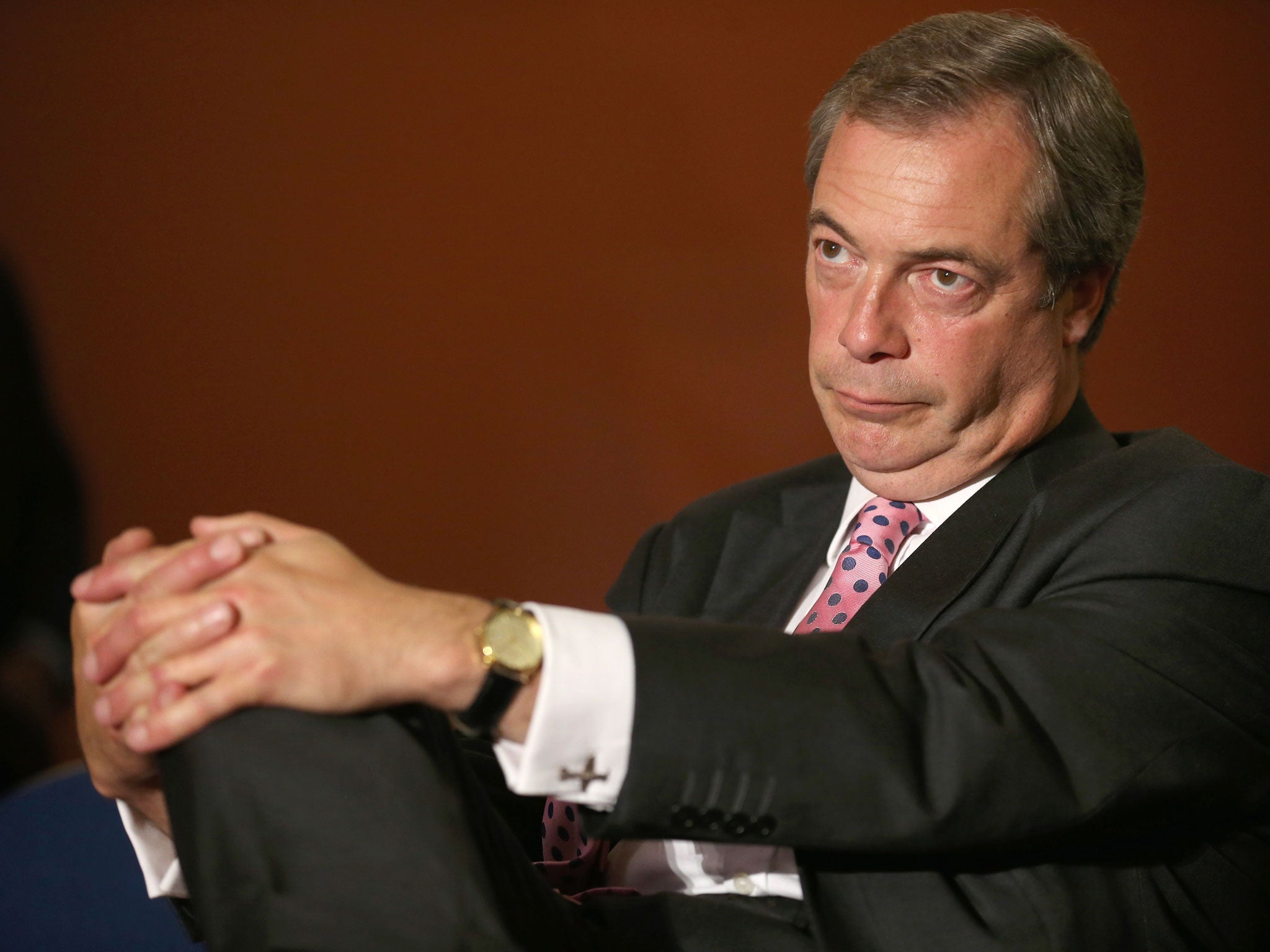 Leader of UKIP Nigel Farage as he listens to a speaker during the party conference on 20 September, 2013 in London.