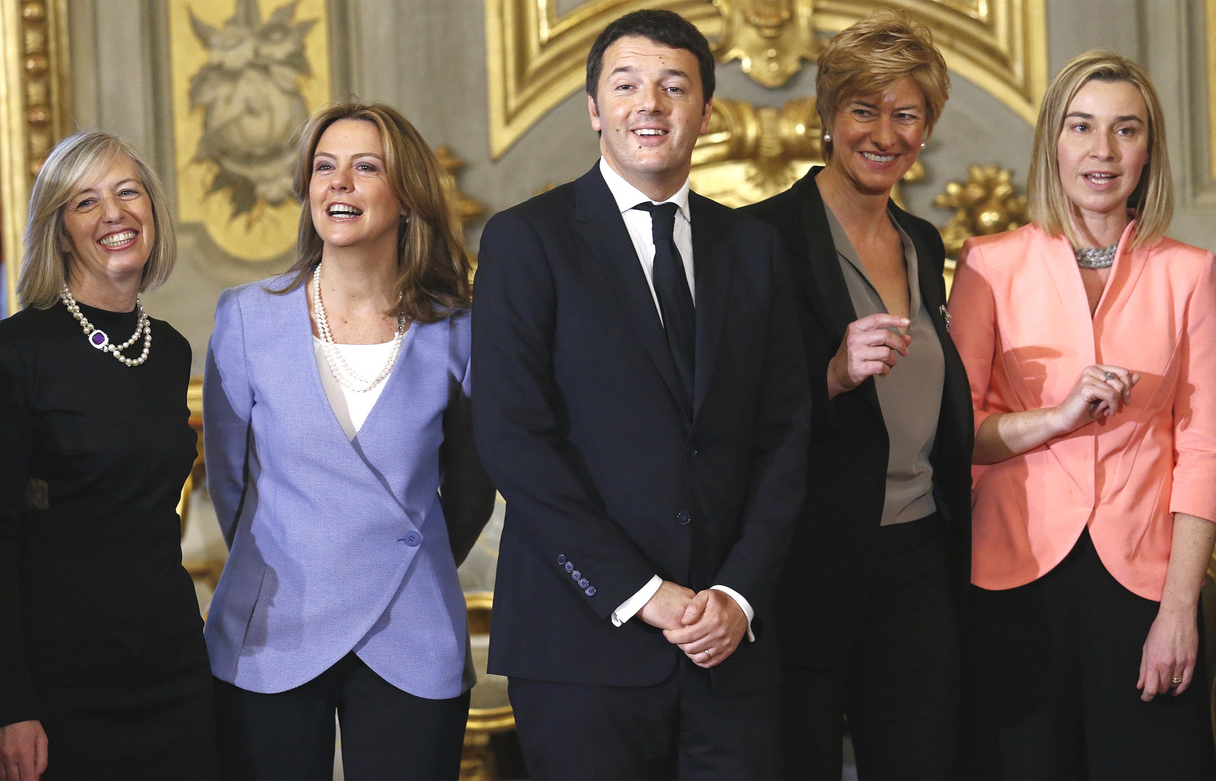 Matteo Renzi (centre) posing with his new ministers (from left) for education, Stefania Giannini; health, Beatrice Lorenzin; defence, Roberta Pinotti; and foreign affairs, Federica Mogherini