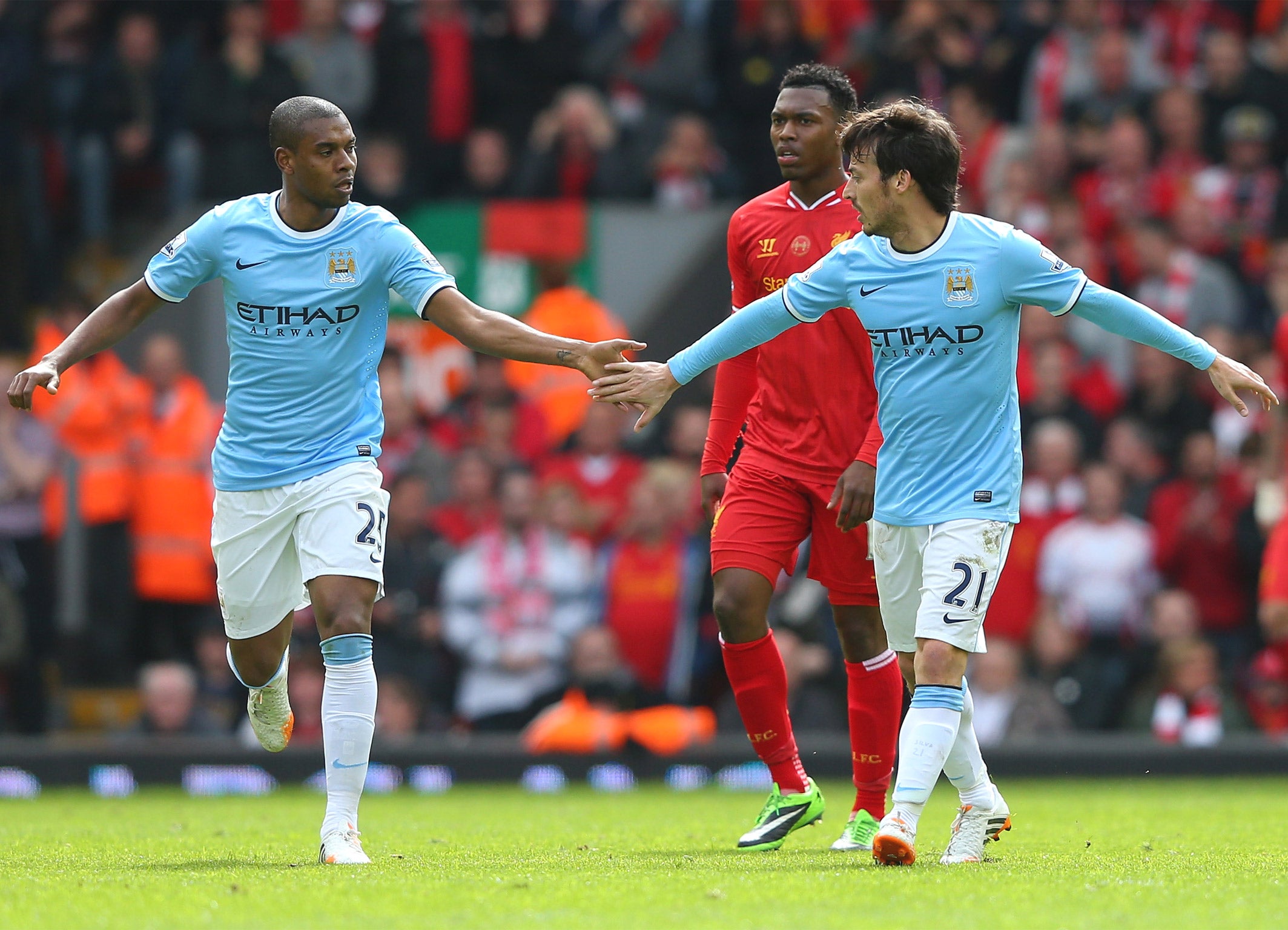 Fernandinho and David Silva celebrate following a Manchester City goal against Liverpool last weekend