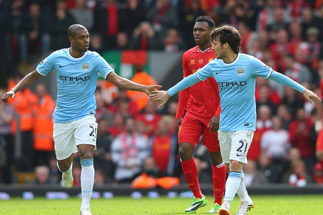 Fernandinho and David Silva celebrate following a Manchester City goal against Liverpool last weekend