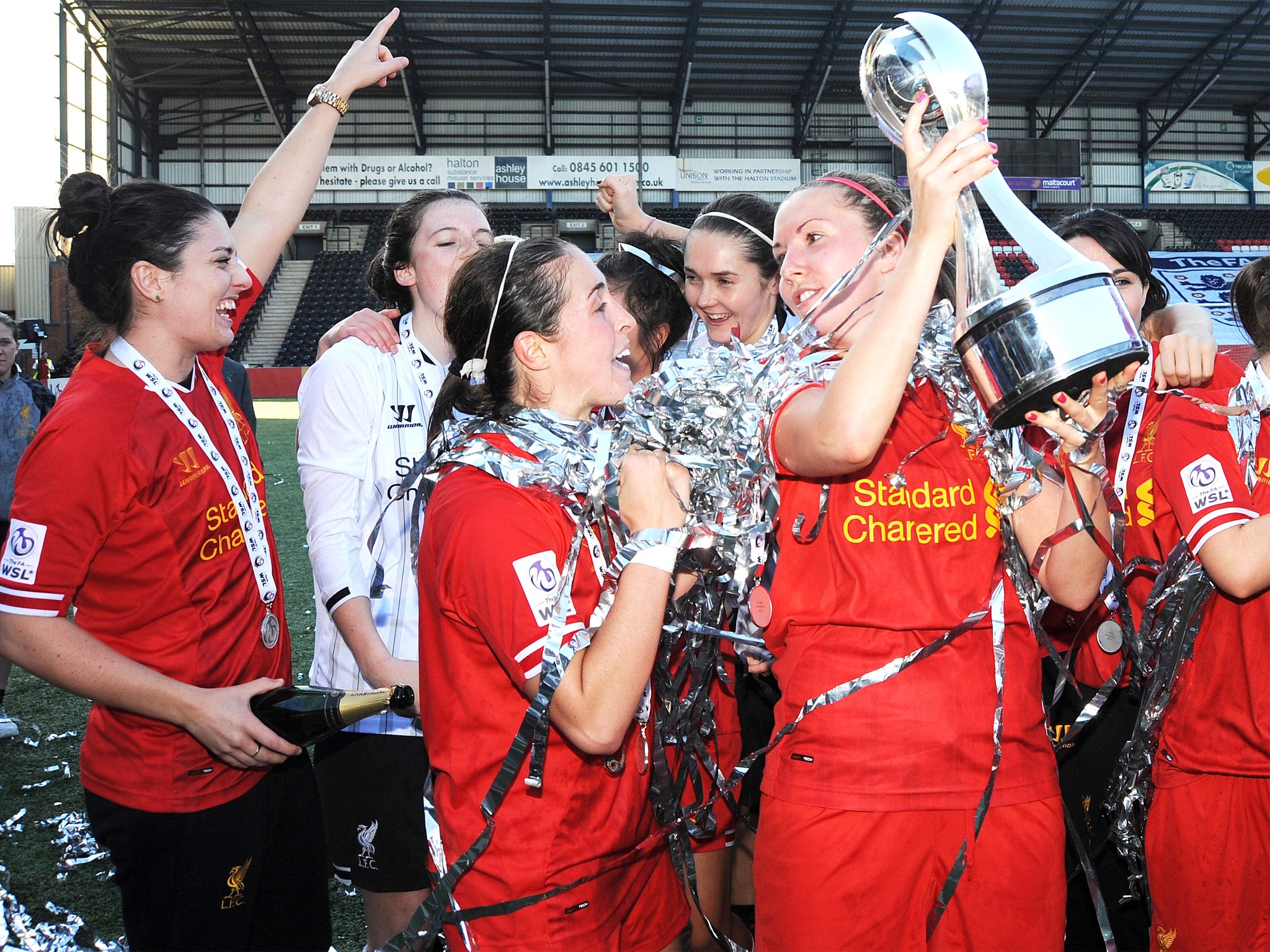 Liverpool celebrate with the Super League trophy last season