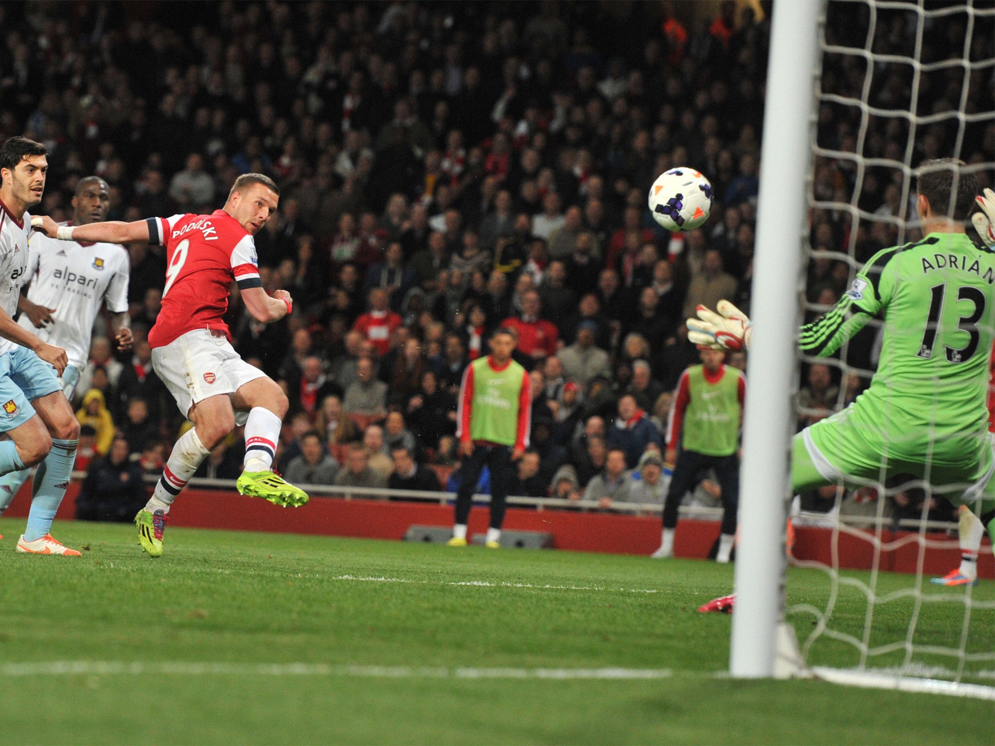Lukas Podolski hammers in Arsenal's third against West Ham