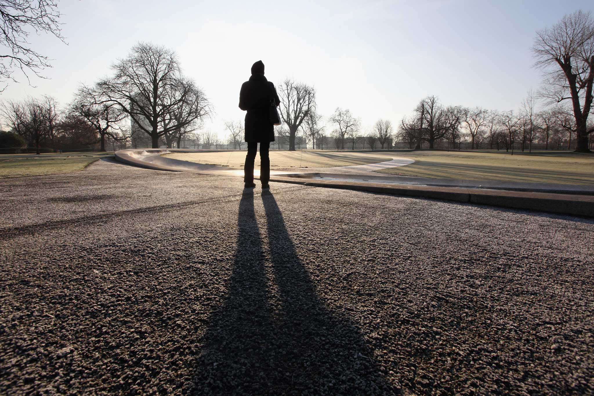 Urban stroller: A woman walks round the Lady Diana memorial in Hyde Park, London