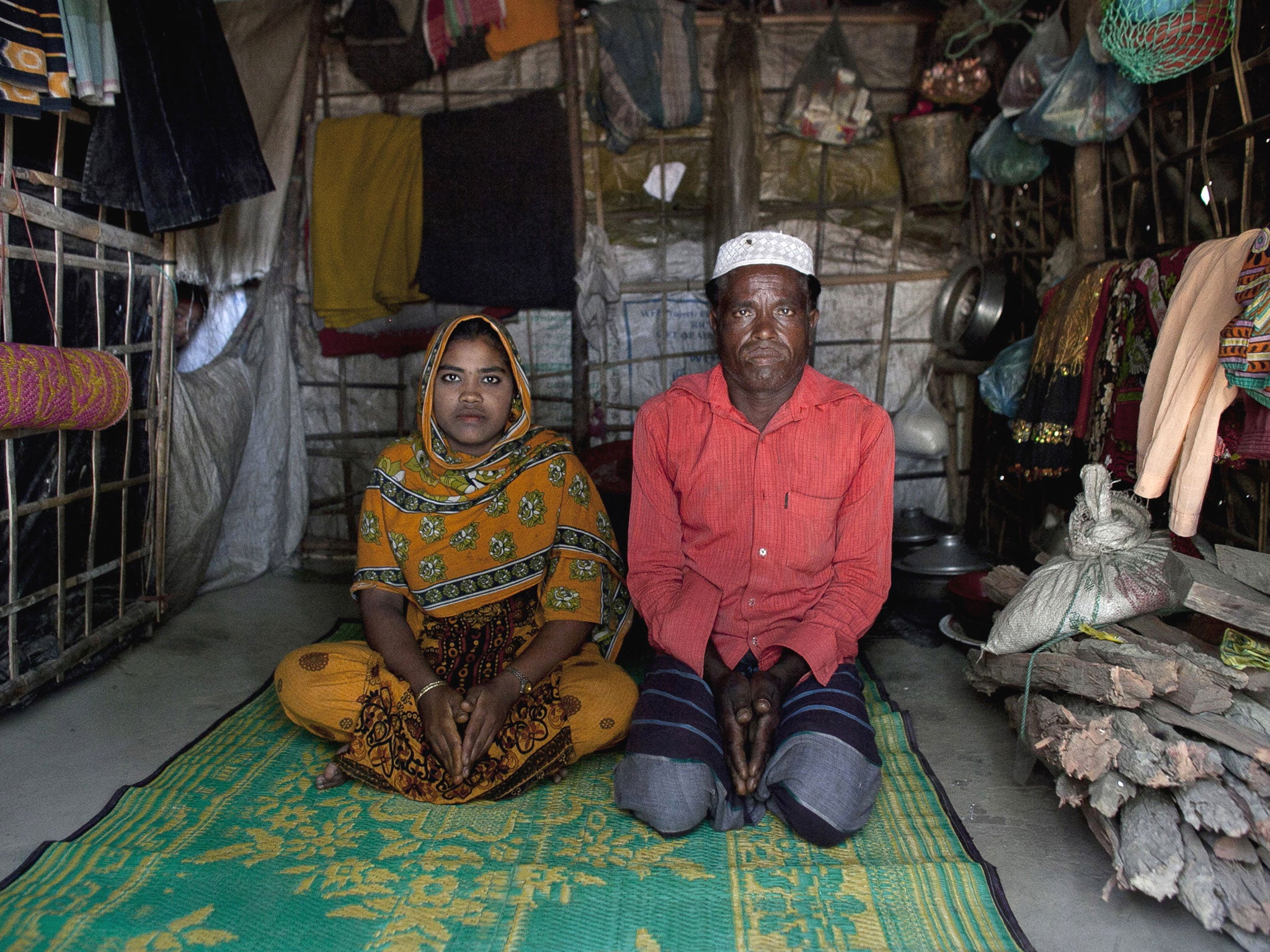 Hamid and his daughter Rajama sit inside their home in the Shamalapur Rohingya refugee settlement in Chittagong district. They fled to Bangladesh from the Dhuachopara village in the Rachidhong district of Myanmar