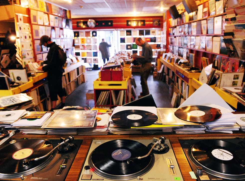 Customers browse through Vinyl Junkies record shop in Berwick Street, Soho, London