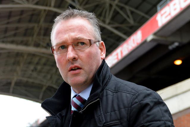 Paul Lambert looks on from the dugout