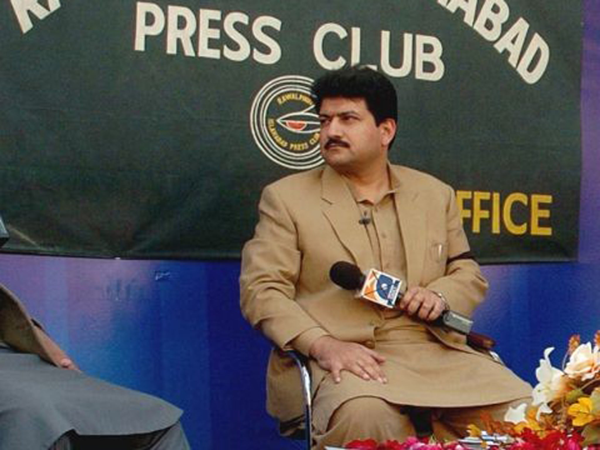 Police say Hamid Mir, a host on the private television broadcaster Geo, was wounded in the attack Saturday near Karachi's airport