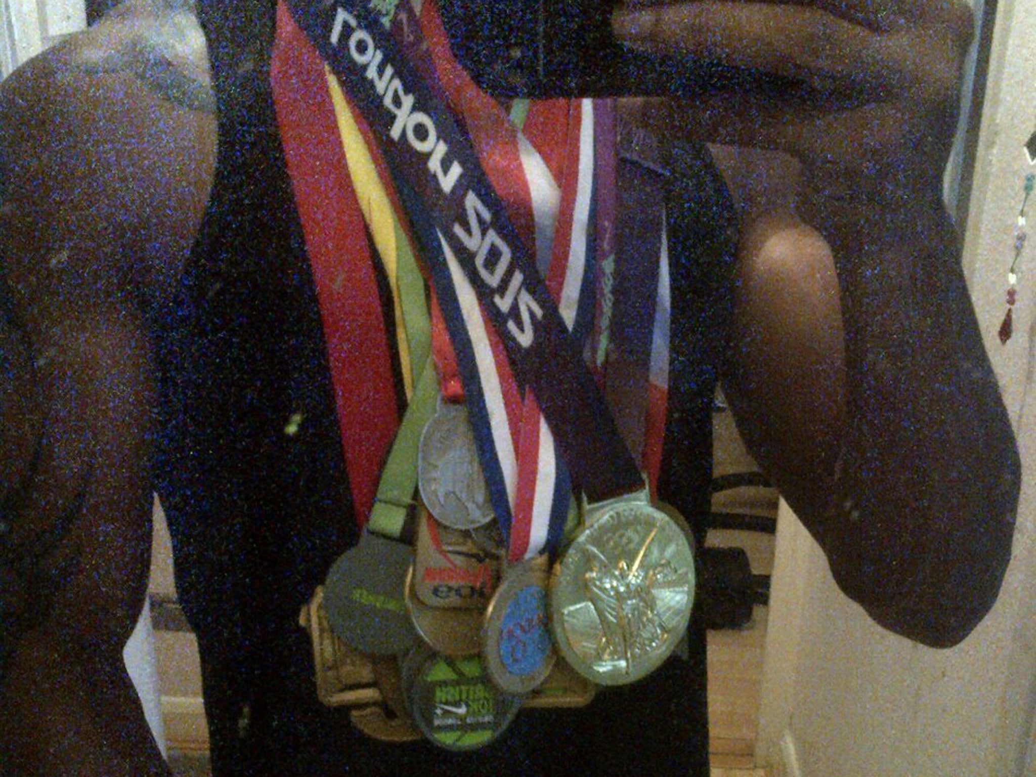 Jason Scotland-Williams with his previous marathon medals