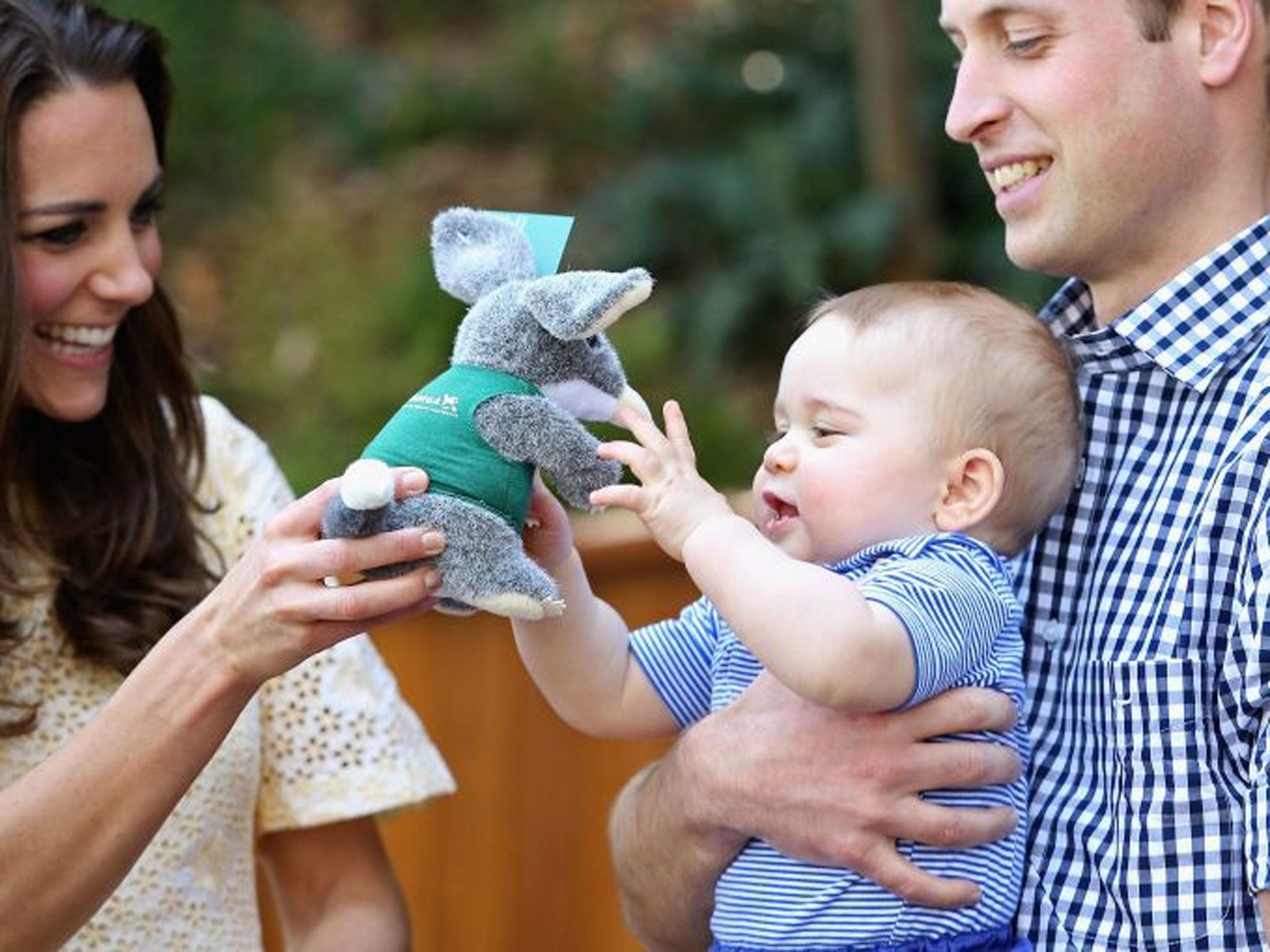 The Duke and Duchess of Cambridge with Prince George of Cambridge holding toy bilby at the unveiling a plaque, opening the Bilby enclosure during a visit to at Taronga Zoo in Sydney, Australia, the Duke and Duchess of Cambridge are on a three-week tour of