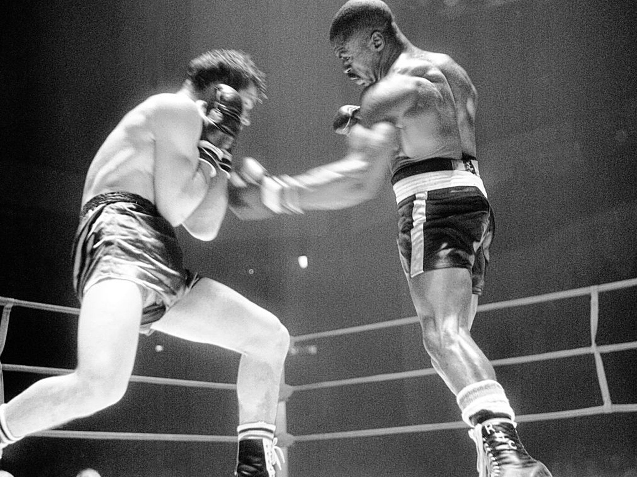 Carter, right, on his way to knocking out the Italian boxer Fabio Bettini in Paris in 1965