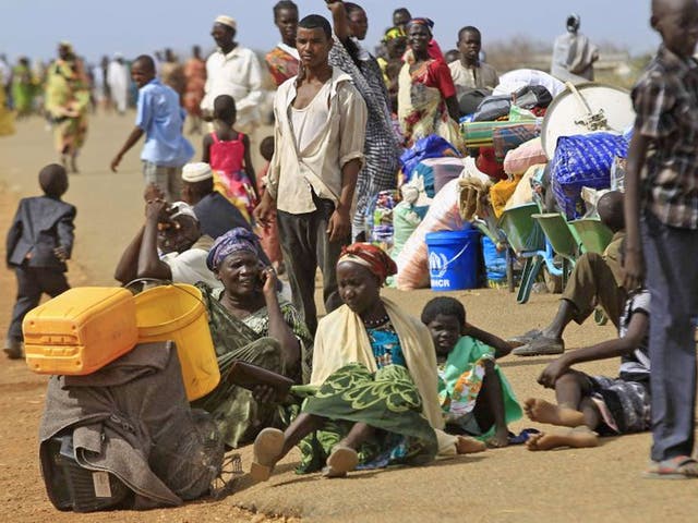 South Sudanese fleeing an attack on the South Sudanese town of Rank, wait to register after arriving at a border gate in Joda, along the Sudanese border