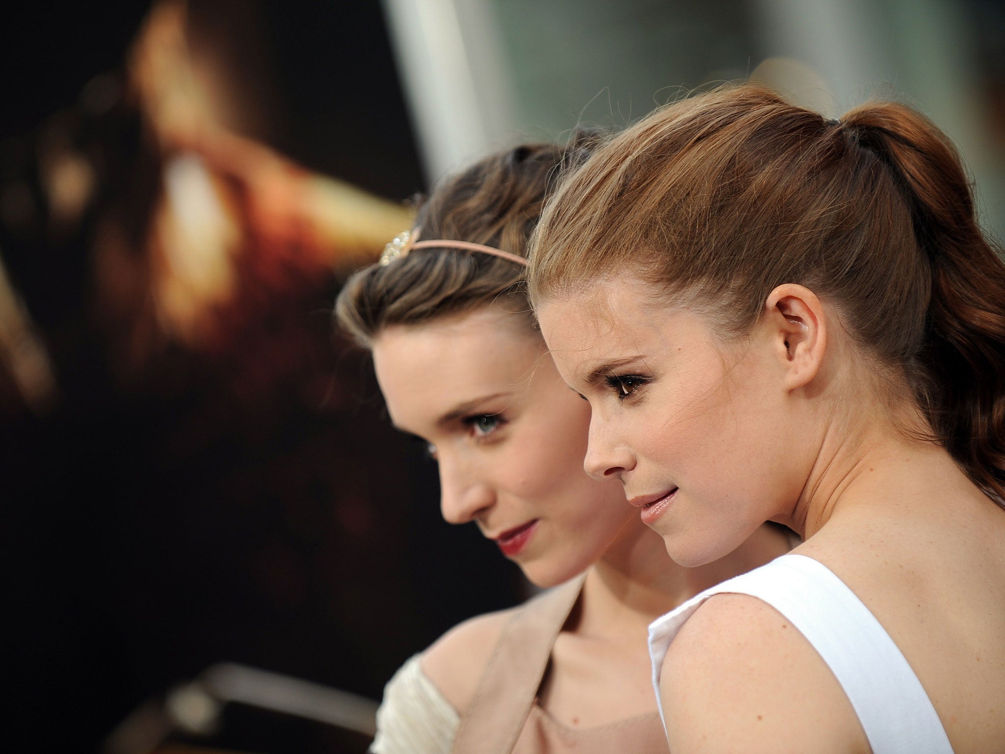 No longer invisible: Kate Mara (left); and with sister Rooney in 2010