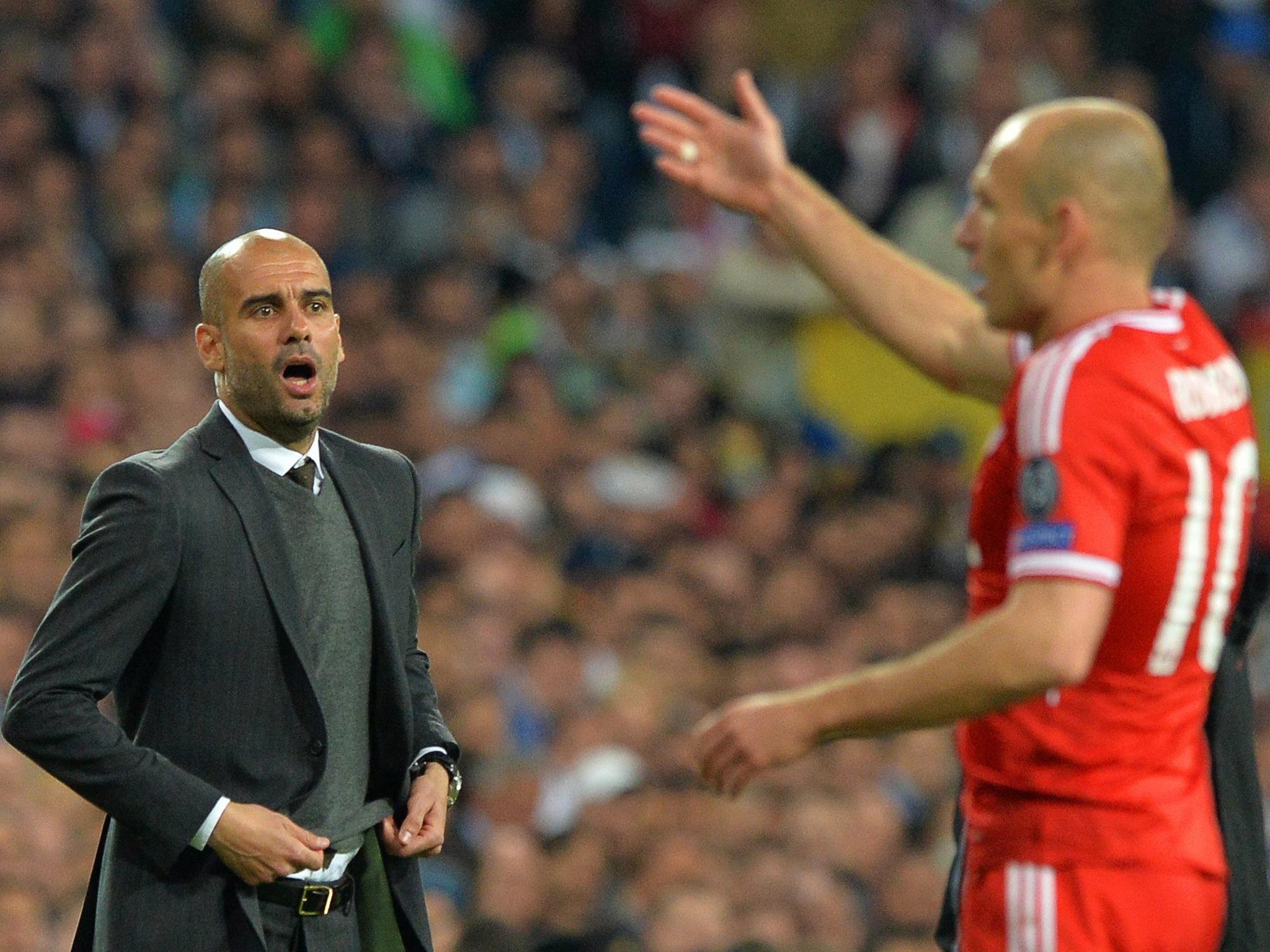 Pep Guardiola shouts out orders to Arjen Robben during Wednesday’s defeat