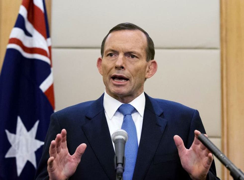 Australian Prime Minister Tony Abbott speaks during a press conference at a hotel in Beijing, China. Abbott said Monday, April 28 that the underwater hunt for the missing Malaysia Airlines jet will be expanded to include a massive swath of ocean floor tha