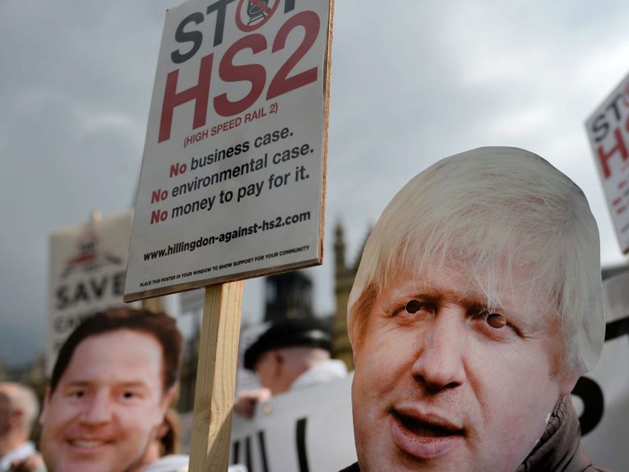 Stop HS2 campaigners, some wearing masks of London Mayor Boris Johnson, were protesting outside parliament
