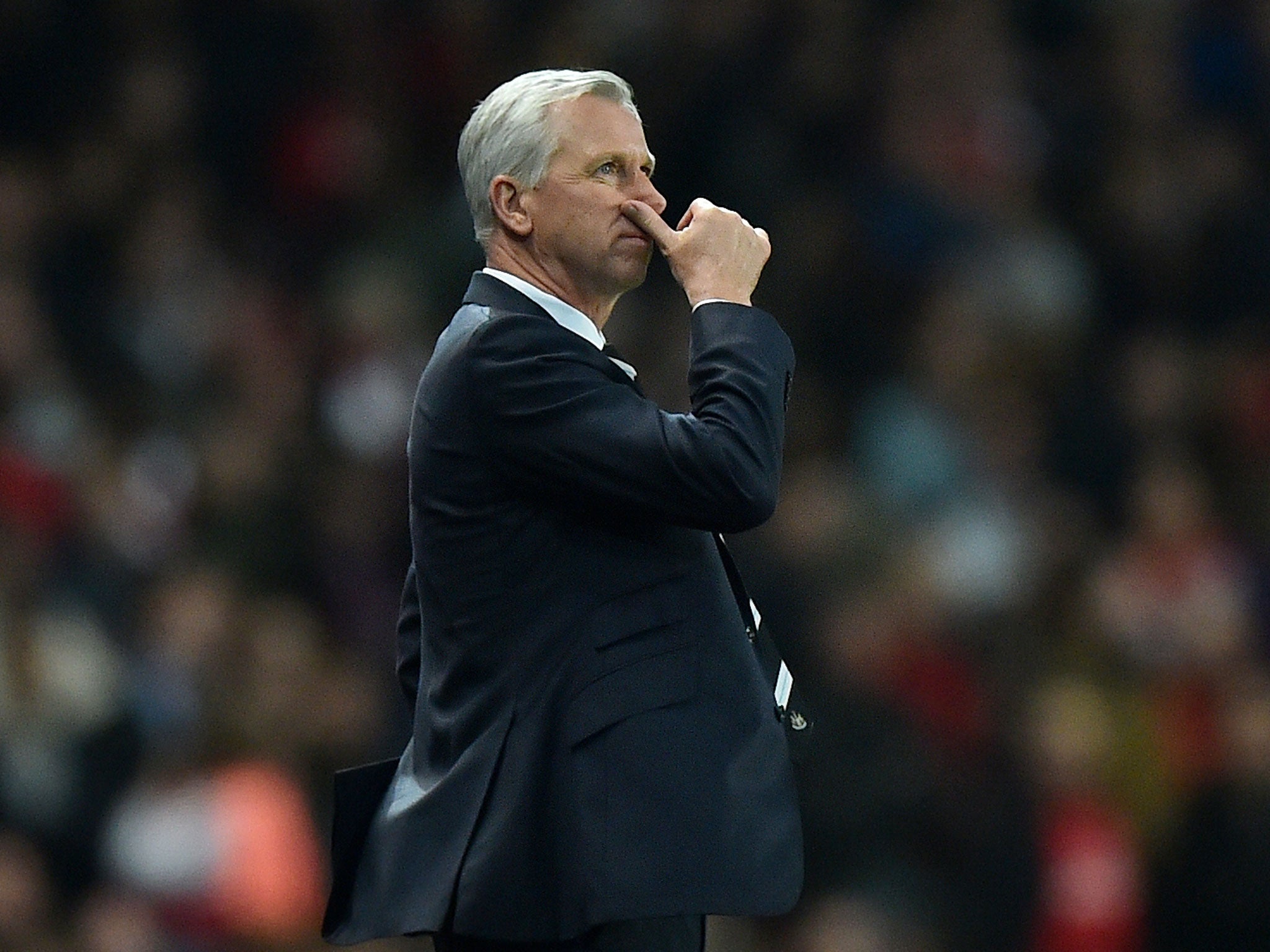 Alan Pardew returned to the touchline for the first time after a seven-match ban at the Emirates on Monday